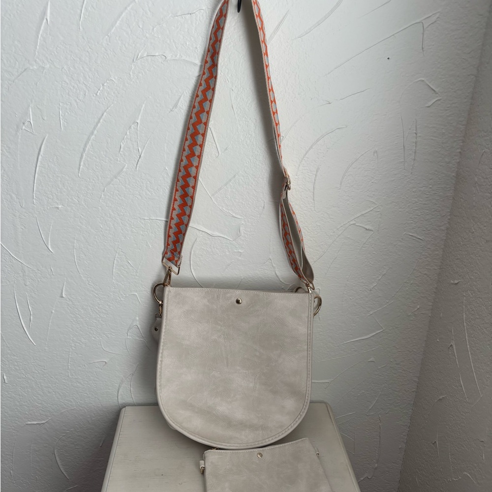 Elegant Cream Crossbody Bag with Patterned Strap